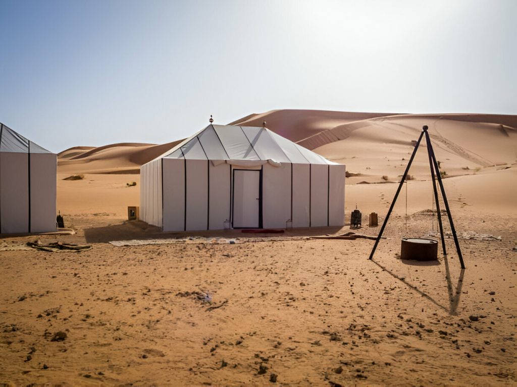 Erg Chigaga desert camp Morocco with large dunes and luxury tents